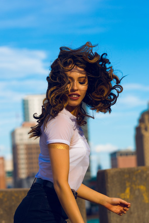 woman dances on rooftop